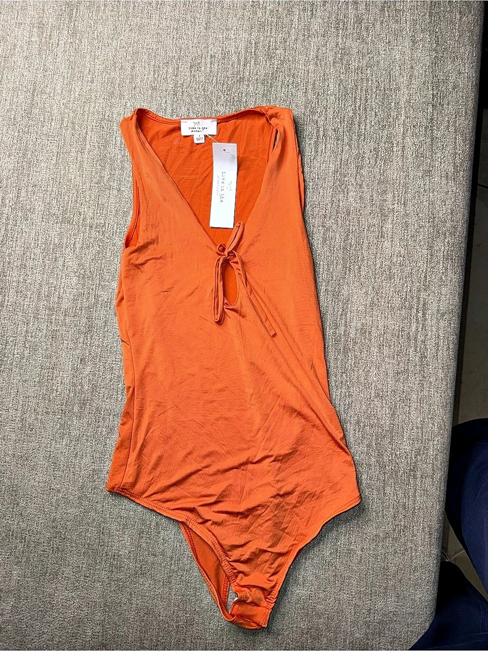 Live in the Moment Orange Tie Front Cutout Bodysuit Size S NWT Flaw